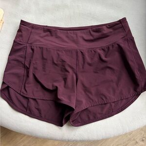 Lululemon maroon/burgundy women’s 4 inch speed up shorts. Like new condition.